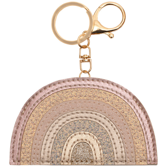 mimi & lula regenboog sleutelhanger met roze, gouden en zilveren glitterstrepen en een gouden ring.