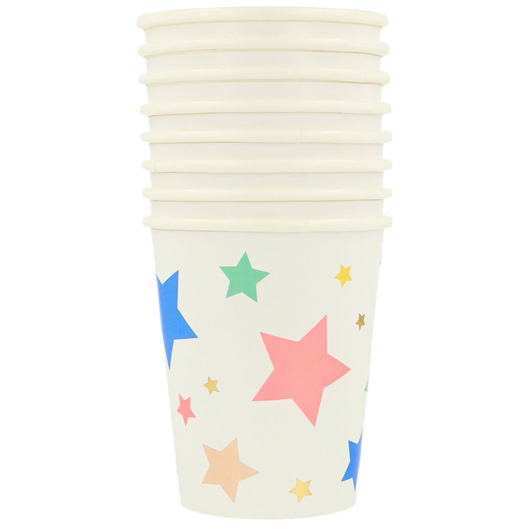 Meri Meri papieren feestbeker met een beige achtergrond en kleurrijke sterren.