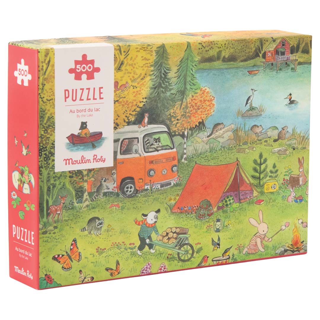 Moulin Roty legpuzzelverpakking met een illustratie van kamperende dieren bij een meer.