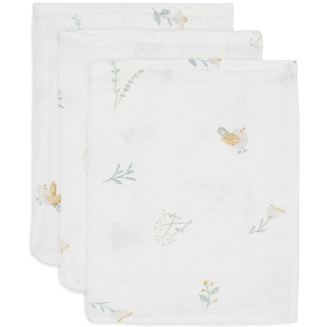 Drie Jollein hydrofiele washandjes met een patroon van vogels en bloemen.
