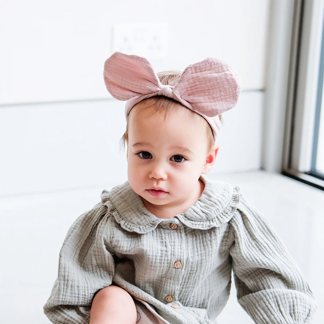 mimi & lula babyhaarband met grote strik - pink