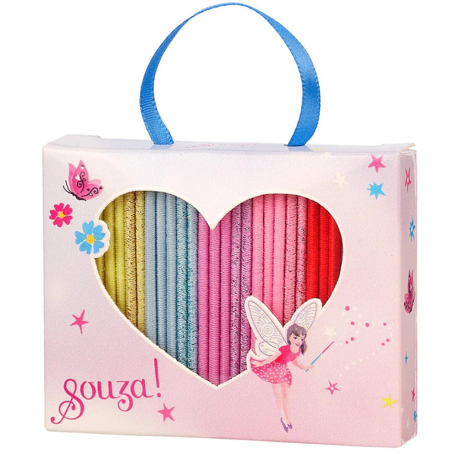 Souza for kids verpakking met een hartvormig venster dat regenboogkleurige haarelastiekjes toont, versierd met een fee en vlinders.