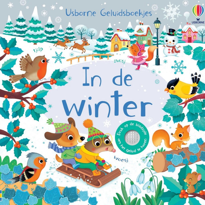 De voorkant van het Usborne geluidenboek 'In de winter' met een illustratie van winterdieren in een besneeuwd landschap.