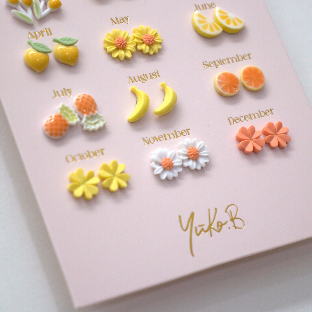yuko b. oorbellen geel en oranje - 12 paar | YB500224 | 1
